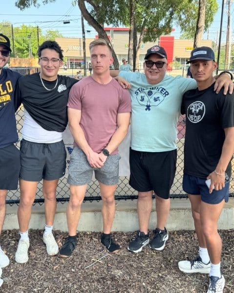 Team Revelation with players at a youth pickleball tournament it sponsored